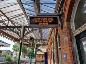 Empty platform with information screen displaying strike update