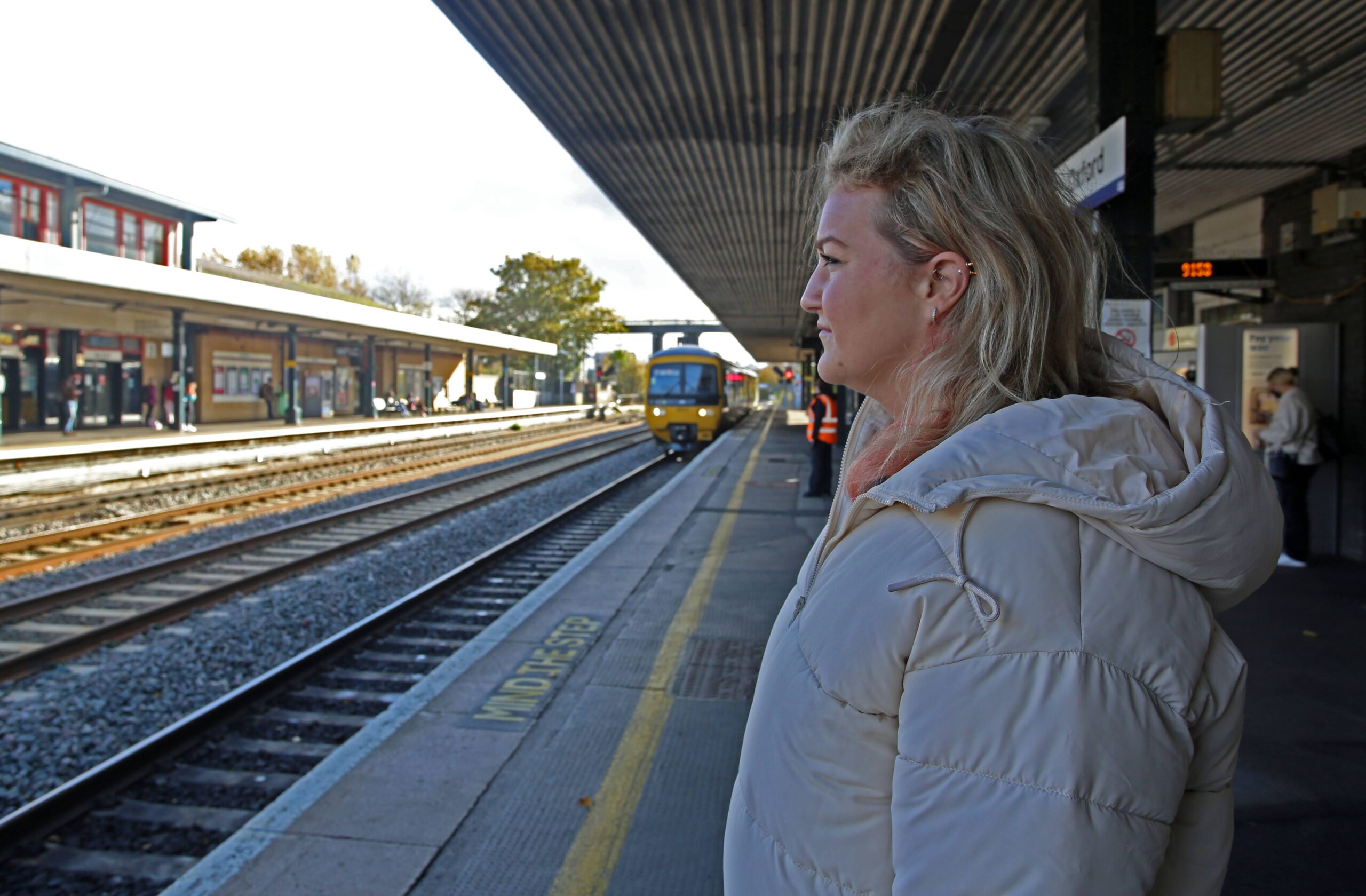 woman waiting on train platform