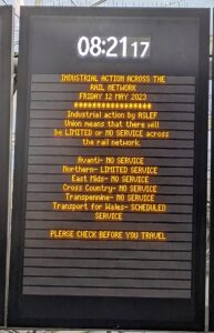 Industrial action message on a board at a train station.